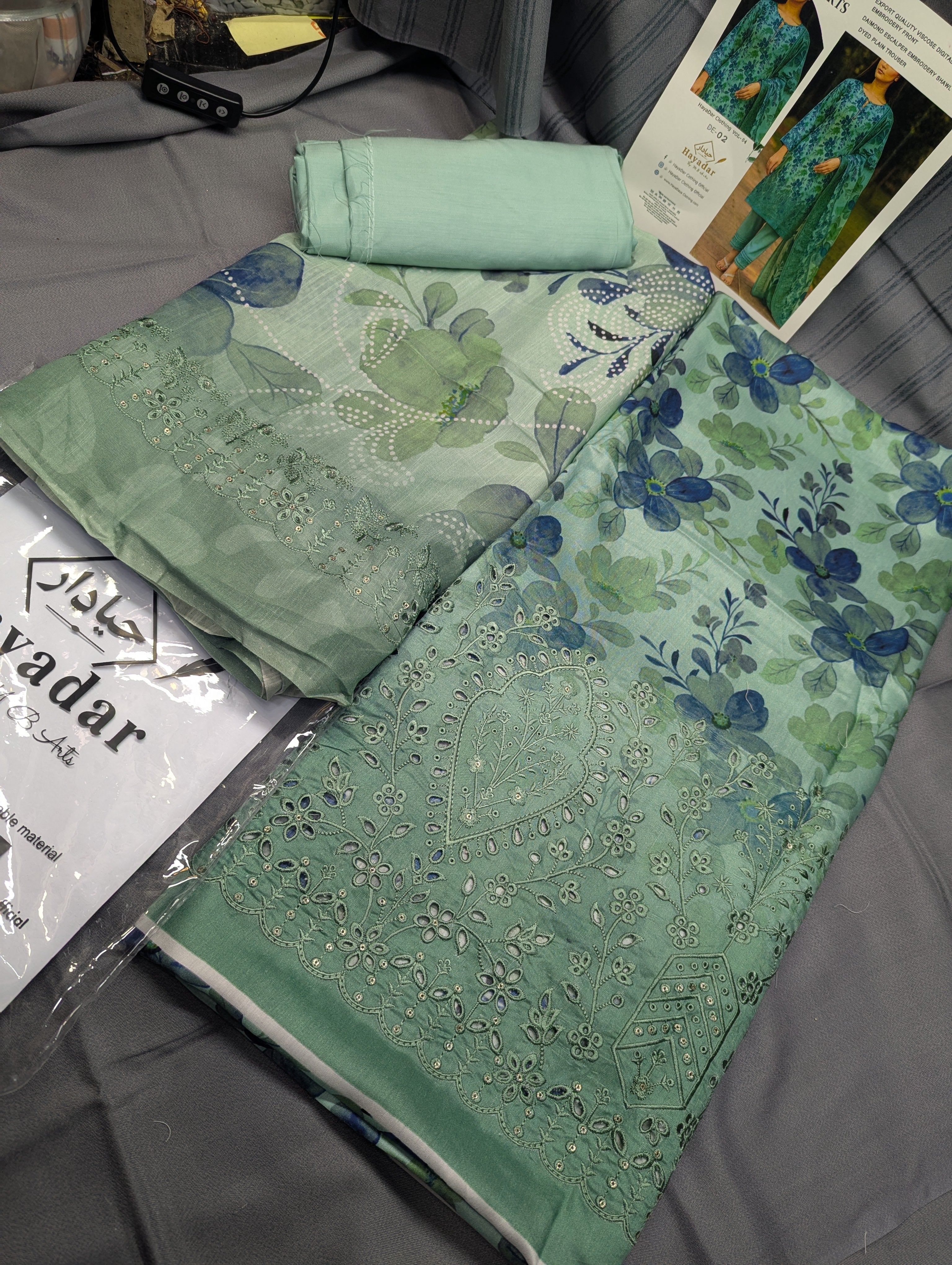Light green 3-piece viscose embroidery winter outfit by Hayadar Clothing, featuring export quality print and stylish design.